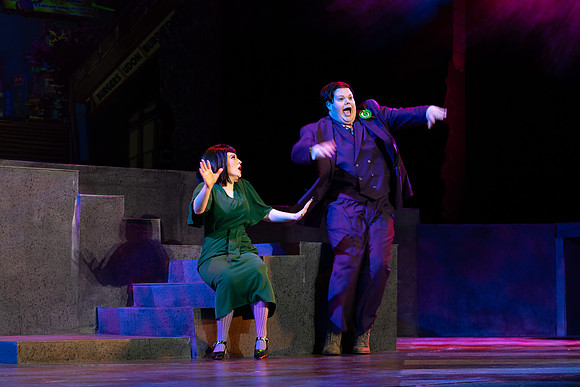 Students performing in the play The Mikado.