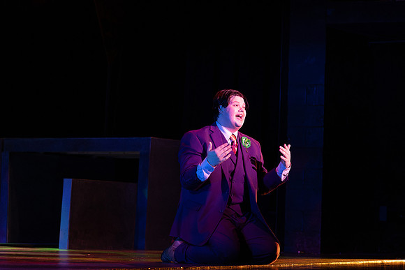 Students performing in the play The Mikado.