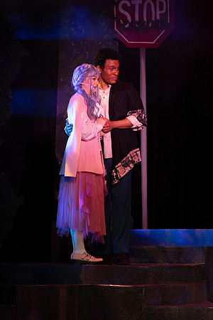 Students performing in the play The Mikado.