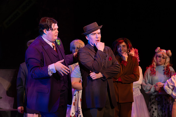 Students performing in the play The Mikado.