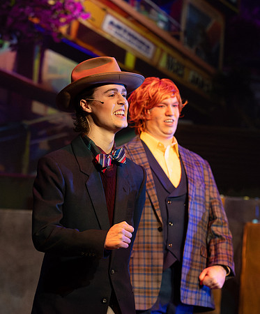 Students performing in the play The Mikado.