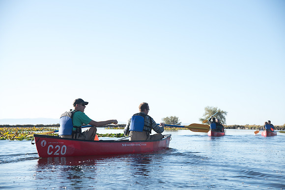Students in the class of Principle of Fish Management,taught by Brother Billman, learn how to set gill nets to capture fish in the ponds at Sand Creek.
