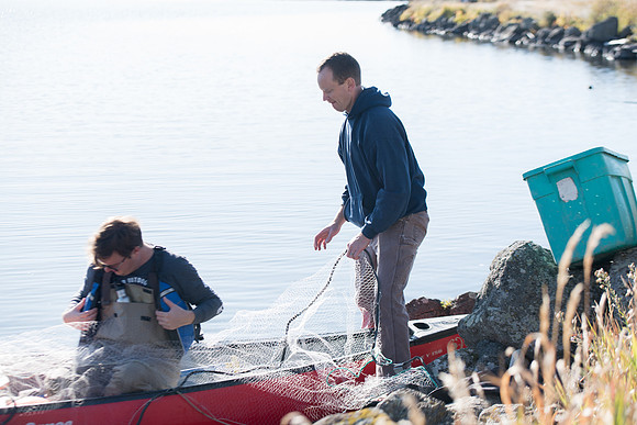 Students in the class of Principle of Fish Management,taught by Brother Billman, learn how to set gill nets to capture fish in the ponds at Sand Creek.