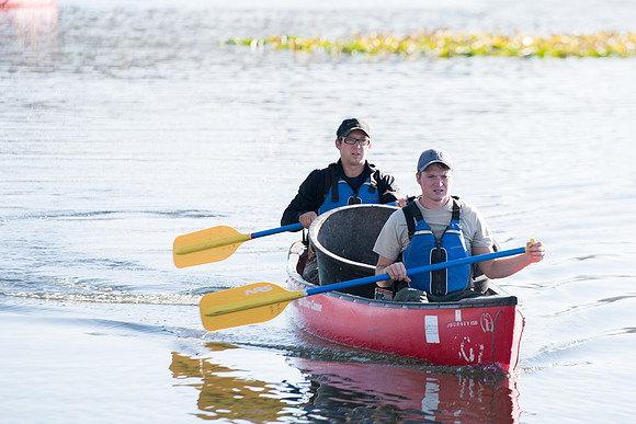 Students in the class of Principle of Fish Management,taught by Brother Billman, learn how to set gill nets to capture fish in the ponds at Sand Creek.