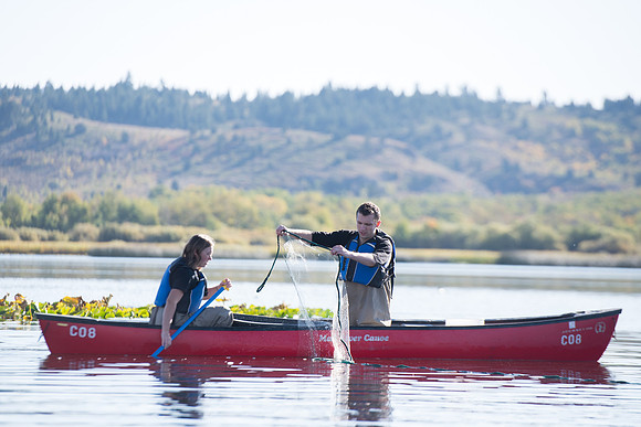 Students in the class of Principle of Fish Management,taught by Brother Billman, learn how to set gill nets to capture fish in the ponds at Sand Creek.