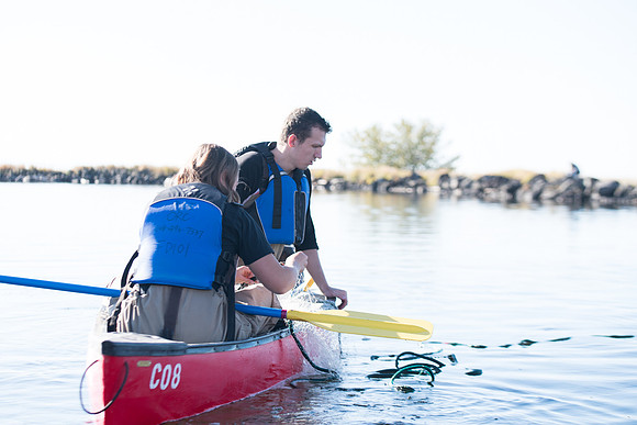 Students in the class of Principle of Fish Management,taught by Brother Billman, learn how to set gill nets to capture fish in the ponds at Sand Creek.