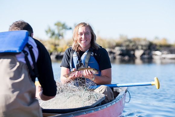 Students in the class of Principle of Fish Management,taught by Brother Billman, learn how to set gill nets to capture fish in the ponds at Sand Creek.