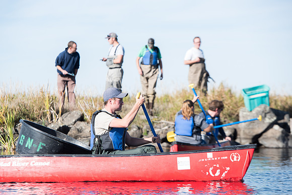 Students in the class of Principle of Fish Management,taught by Brother Billman, learn how to set gill nets to capture fish in the ponds at Sand Creek.