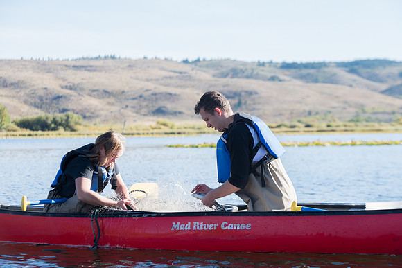 Students in the class of Principle of Fish Management,taught by Brother Billman, learn how to set gill nets to capture fish in the ponds at Sand Creek.