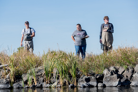 Students in the class of Principle of Fish Management,taught by Brother Billman, learn how to set gill nets to capture fish in the ponds at Sand Creek.