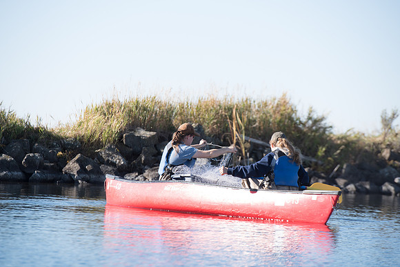 Students in the class of Principle of Fish Management,taught by Brother Billman, learn how to set gill nets to capture fish in the ponds at Sand Creek.