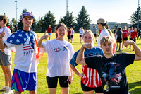 Students gather at the upper field for various 4th of July activities.