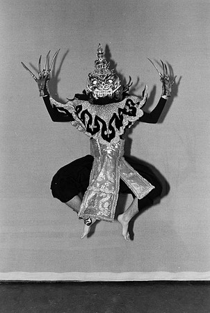 A man with a mask jumping in the air.