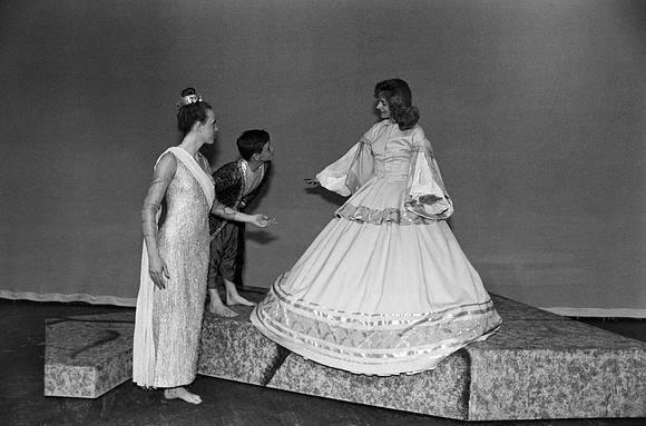 A lady and a kid are talking to a women.