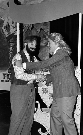 Actors shaking hands.