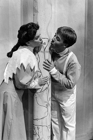 A couple posing as if they are going to kiss.