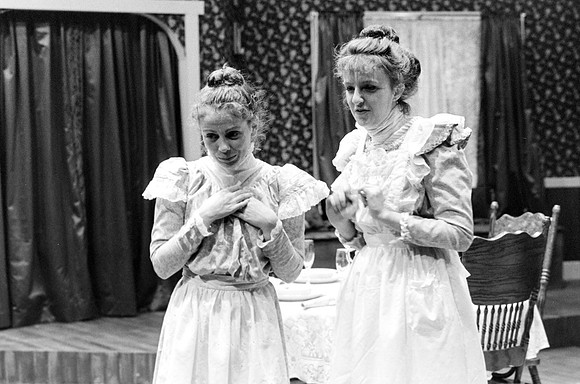 Two maids talking.