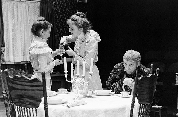Maids pouring water in a cup for old Lace.