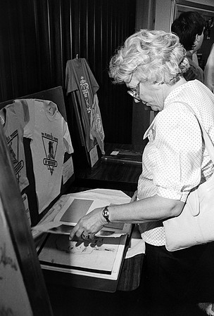 Playmill participant looking at a book.