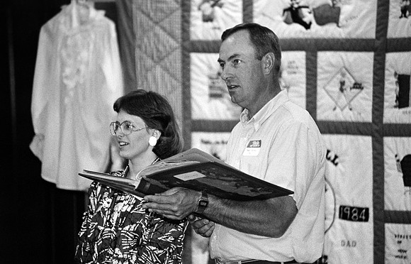 Playmill participant looking at a photo album.