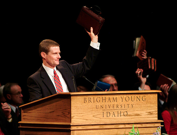 Pres. David A Bednar displays his scriptures to show he is ready to learn.