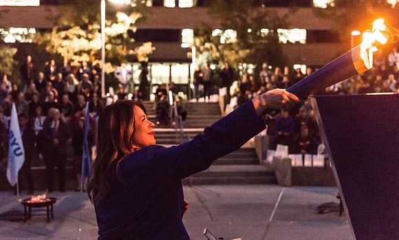 The Torch lighting ceremony held in the amphitheater court, Fall semester.