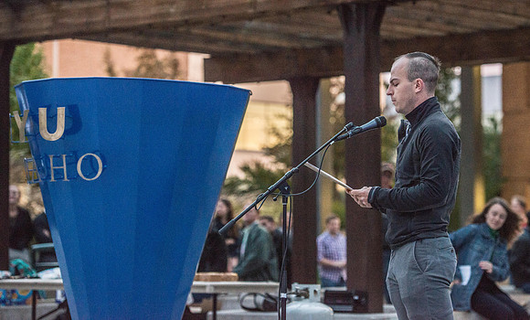 The Torch lighting ceremony held in the amphitheater court, Fall semester.