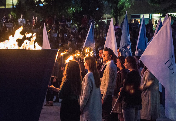 The Torch lighting ceremony held in the amphitheater court, Fall semester.