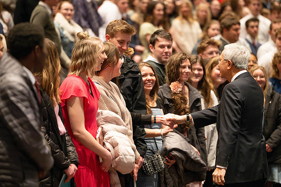 Elder and Sister Gong address BYU-Idaho students during devotional.