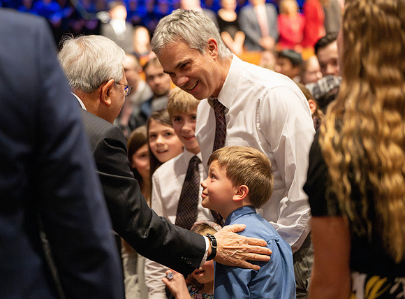 Elder and Sister Gong address BYU-Idaho students during devotional.