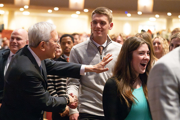 Elder and Sister Gong address BYU-Idaho students during devotional.