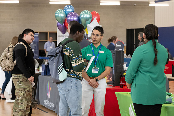 Students gather in the I-Center courts at the 2024 Winter Career fair.