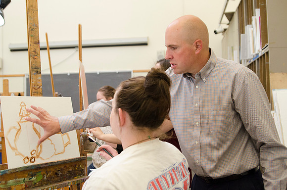 David Belka enthusiatically teaches painting principles to beginning painting class.