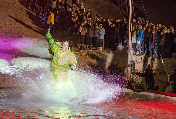 Students at Brigham Young University-Idaho take part in the annual Pond Skimming event held on campus at BYU-Idaho. Students wait in the cold or take the daring attempt to skim a pool of water using a