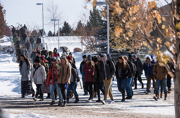 Students walking into devotional in the snow, Fall Semester.