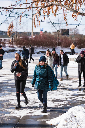 Students walking into devotional in the snow, Fall Semester.