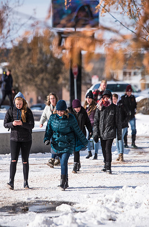Students walking into devotional in the snow, Fall Semester.