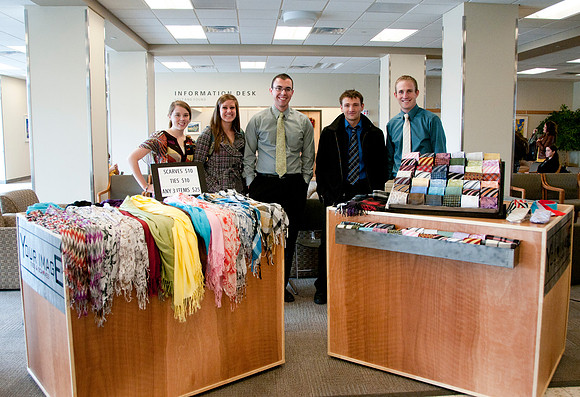 Students from the IBC Business class sell ties and scarfs in the MC Building.