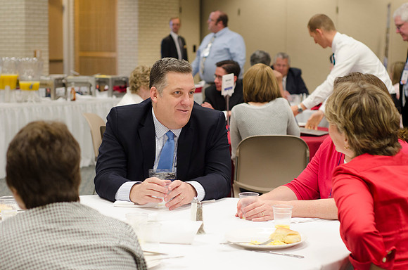 Online instructors gather for breakfast and instruction.