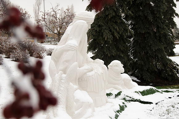 Light snow was faling around the Nativity Decorations outside the Taylor Building.