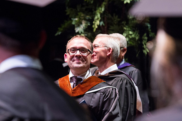 Dean's of the College of Performing and Visual Arts award diplomas to graduates during convocation held in the Snow Building.