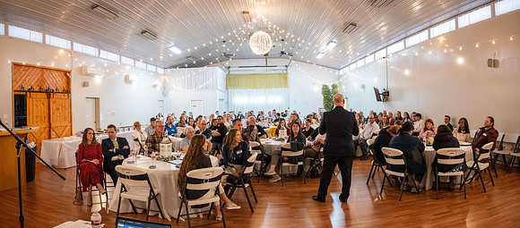 Alumni in the Cache Valley area gather at Eagles Landing Event Center, in Smithfield, Utah and get the chance to listen to and meet President Meredith.