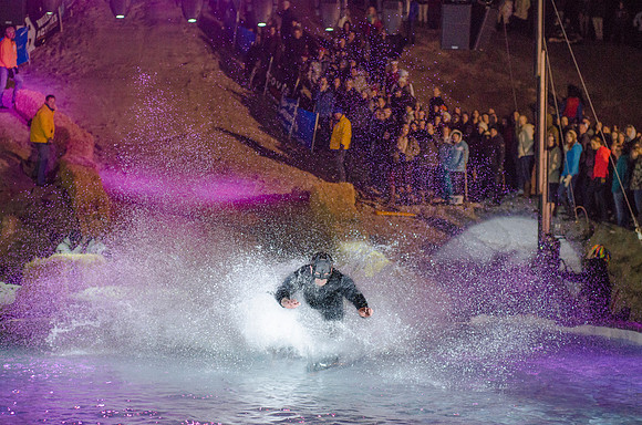 Students at Brigham Young University-Idaho take part in the annual Pond Skimming event held on campus at BYU-Idaho. Students wait in the cold or take the daring attempt to skim a pool of water using a