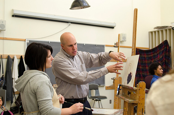 David Belka enthusiatically teaches painting principles to beginning painting class.