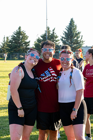 Students gather at the upper field for various 4th of July activities.