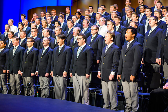 The men's and women's combined choir perform during devotional held in the BYU-Idaho Center, Fall Semester.