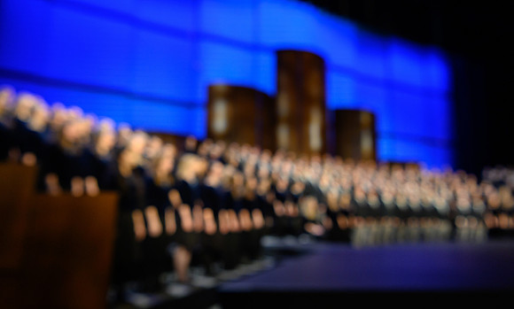 The men's and women's combined choir perform during devotional held in the BYU-Idaho Center, Fall Semester.