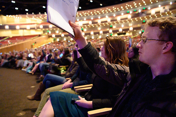 A student shows he is ready to learn during devotional held in the BYU-Idaho center.