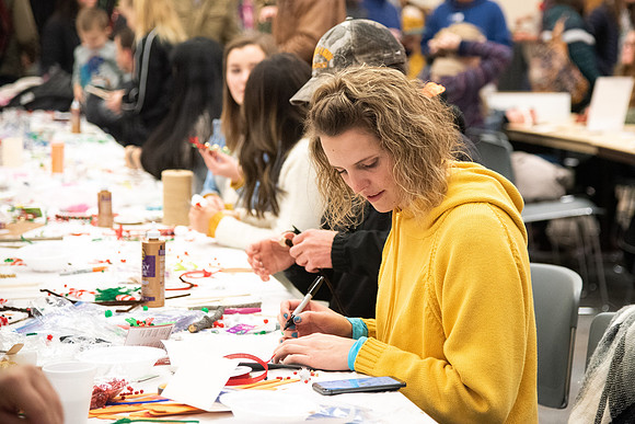 Students decorating cards at the MC