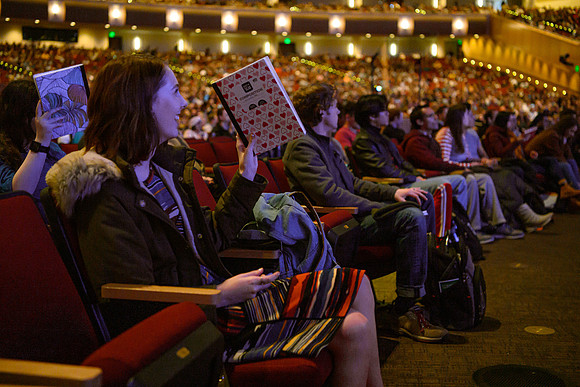 A student shows she is ready to learn during devotional held in the BYU-Idaho center.
